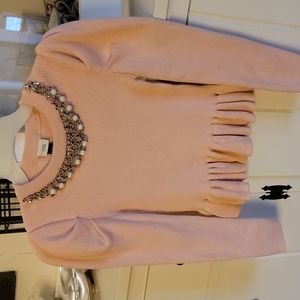 Girls pale pink sweater.